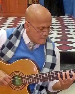 Robert strumming guitar