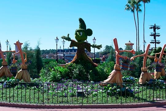 The Mickey, Minnie, and Pluto topiary in the courtyard in front of the tip board.
