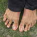 Argentinian woman, showing me how far she can spread her toes. Far.
