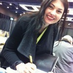 Heidi signing Many Genres, One Craft