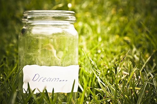 dream jar in a field of grass