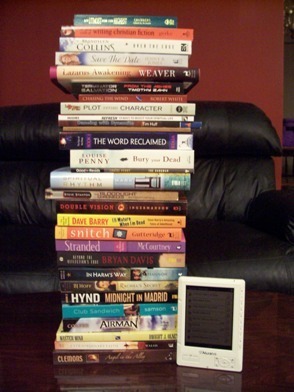 Stack of books and e-reader