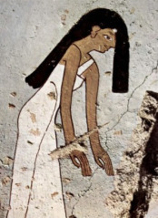 A mourning woman with her hair over her face from the tomb of Minnakht