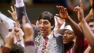 Jim Valvano cut the nets down for real in 1983. Dereck Whittenburg (right) is now on the NC State coaching staff.