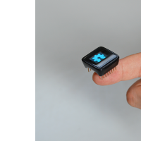 The MicroView on the end of a finger.