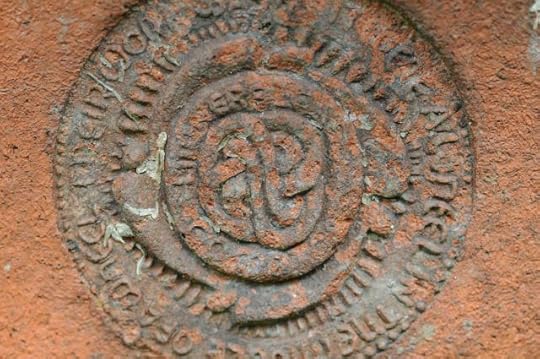 The stamp of the Compton Pottery, Guildford. The motto reads: “THEIR WORK WAS AS IT WERE A WHEEL IN THE MIDDLE OF A WHEEL”