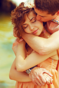 Happy marriage concept. Portrait of a beautiful kissing couple o