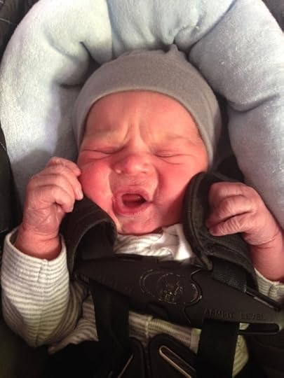 Oliver protesting (silently, but unmistakably) his first insertion into a carseat—at the ripe age of 10 hrs. old.