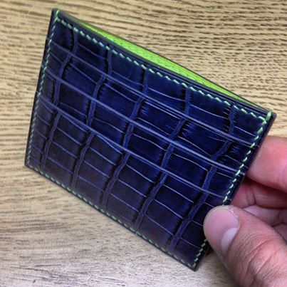 Photo: custom order PN card wallet in dark blue alligator with contrasting lining and stitching in lime #wallet #alligator #saddlestitched #leathercraft #accessories #fashion #luxury