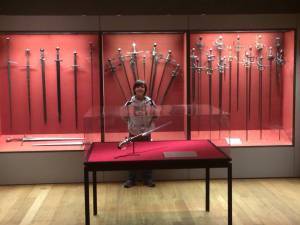 Jackson in front of swords at the Philadelphia Museum of Art