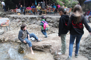 Cooling off the feet in freezing mountain water.