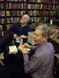 Signing books with another crime writer, Ken Wishnia, at Manhattan's Mysterious Bookshop.