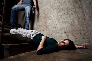 bigstock-Battered-woman-lies-lifelessly-27172106