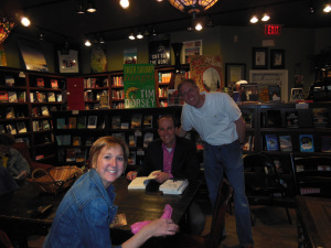 Signing a book for friends, Phil and Debbie Wright