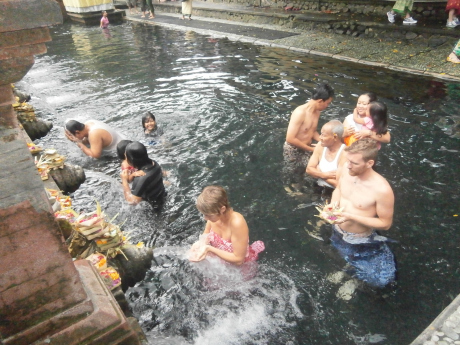 Locals and some converts are making their pilgrimage in Tirta Empul, the source of holy water that flows out to the waterways and irrigation systems in Tampak Siring area. 