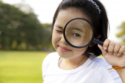 Girl with magnifying glass Image courtesy of Naypong / FreeDigitalPhotos.net