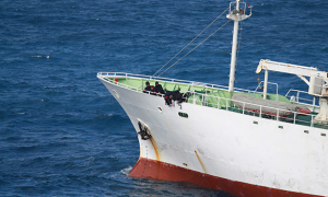 Crew of an illegal fishing vessel paint a new name on the hull in an effort to avoid enforcement for crimes committed under a prior name. 