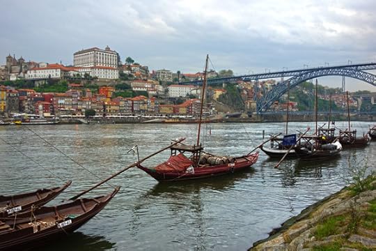 Ribeira View with a Port Buzz Lens Porto ages happily on the Douro River, along with the most of the world’s port wine. The harborfront, called the Ribeira, faces Porto’s sister city, Vila Nova de Gaia, just across the river, where traditional boats that hauled the wine to the port lodges for aging and distribution decorate the scene. After visiting a couple of port lodges for a tour and tasting (as is the ritual for visitors to Vila Nova de Gaia), this view across the Douro of Porto's Ribeira looks even better. 