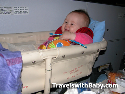 baby in airplane bassinet