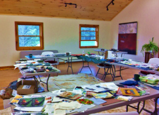 The work tables at last year's class. This year's will be just as filled with papers, colors and idea.