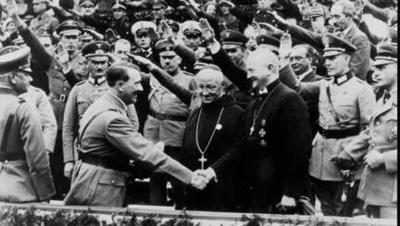 Bishop Ludwig Muller greets Hitler