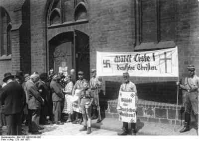 Stormtroopers holding Deutsche Christen propaganda during the Church Council elections