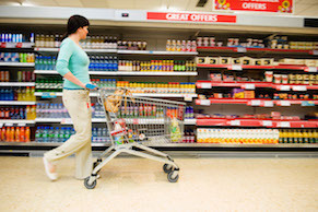 Shopper with Cart in Supermarket