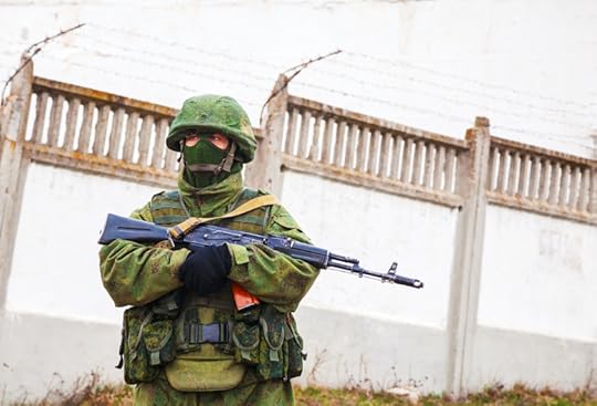 Perevalne, Ukraine - March 4, 2014: Russian soldier guarding an Ukrainian military base near Simferopol city. The Russian military forces invaded Ukrainian Crimea peninsula on February 28, 2014. © AndreyKrav via iStockphoto