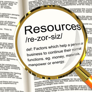 A magnifying glass over a dictionary entry of the word resources