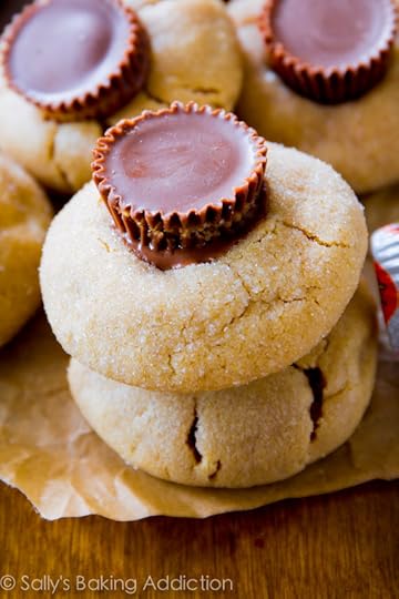 Peanut Butter Cup Blossoms by sallysbakingaddiction.com. Soft-baked, thick style peanut butter cookies topped with Reese's peanut butter cups!