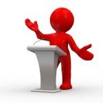 speaking from podium 150x150 How to Make Your Next Presentation Memorable