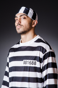 Convict criminal in striped uniform