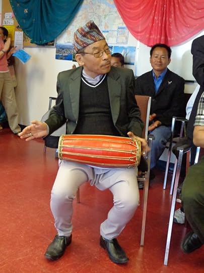 Nepali man playing a madal