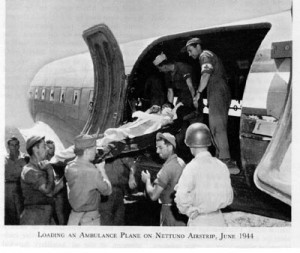 Patient being loaded into plane for air evacuation, Nettuno, Italy, June 1944. (US Army Office of Medical History)