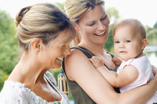 Grandmother, mother and daughter by lake, head and shoulders. Image shot 2006. Exact date unknown.