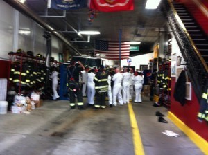 Sailors examining a fire truck in lower Manhattan