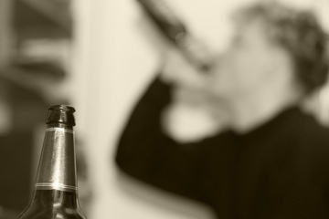 Guy drinking beer.