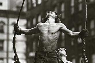 a construction worker holding ropes