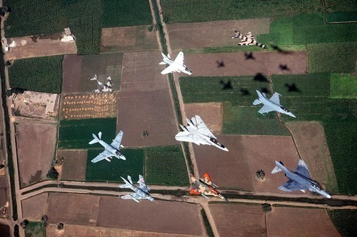 Front clockwise, F-4 Phantom, French Mirage 2000, Mig 19 Farmer , A-6 Intruder, Mig 15, A-7 Corsair, Mig 21 Fishbed, F-16 Falcon & Middle is F-14 Tom Cat.