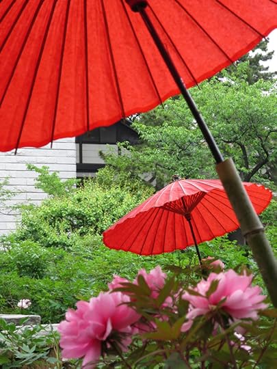 Blooming plants get their own parasols at Nishiaria Daishi Temple.