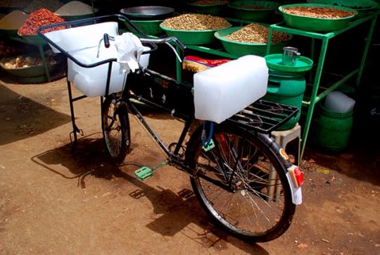 A case of diminishing returns: selling ice in 45°C (113°F) heat, Omdurman souq, Sudan, Africa