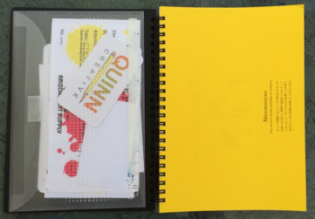 Open notebook showing yellow first page (others are white) and pocket insert that does NOT come with the notebook.