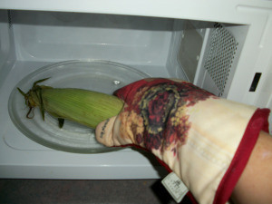 Carefully remove cooked ear of corn.