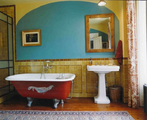 Colorful bathroom with awesome clawfoot tub.