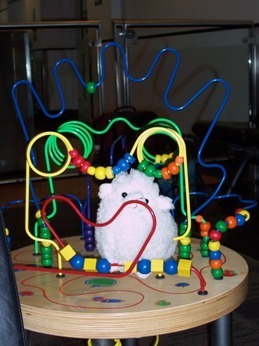 Stuffed sheep in a Busy Beads toy
