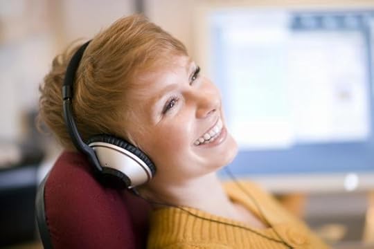 smiling_woman_wearing_headphones_hi