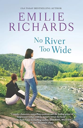 Taylor Martin and Jan Stoddard on the bank of the French Broad River in Asheville, North Carolina