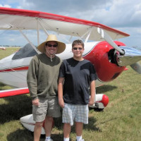 This is a photo of my dad and I from the 2009 Oshkosh EAA AirVenture fly-in in front of our old biplane. I was 14 in the photo, and we flew 2,500 miles from Southern California to Wisconsin over the course of 5 days, stopping every 200 miles along the way for fuel. It was an absolutely incredible trip, and we met a bunch of really cool people both on our way there and at the fly-in. --Bradley Matheus
