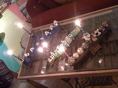 Three menorahs, one candle each