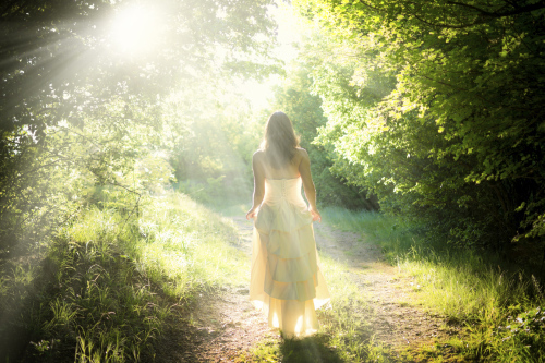 Fairy woman walking in the woods